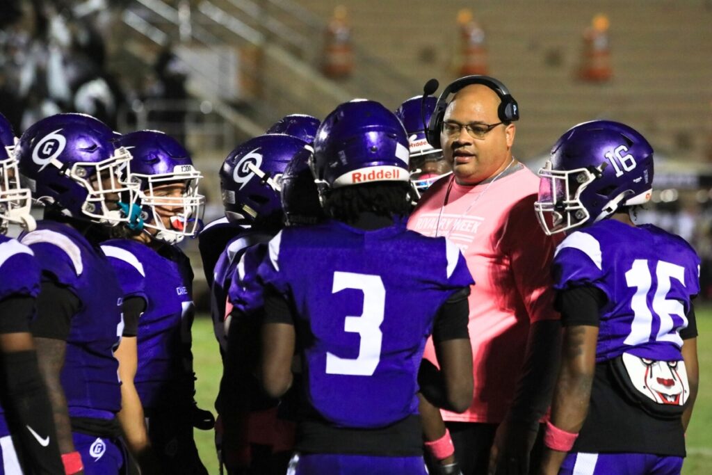 Gainesville head coach Ian Scott talks to the team during a timeout against Buchholz. Photo by Seth Johnson