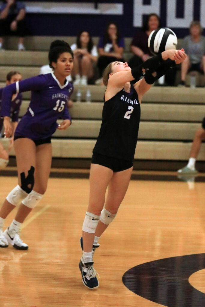 Gainesville's Addyson Hauptman (2) with a dig against Belleview in the Class 5A-District 5 semifinals. Photo by C.J. Gish