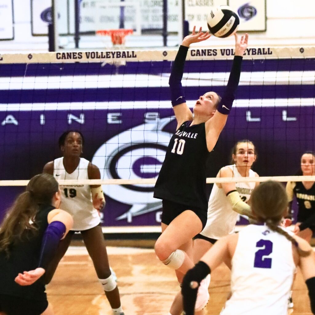 Gainesville's Charlotte Judge (10) with a set against Buchholz. Photo by C.J. Gish