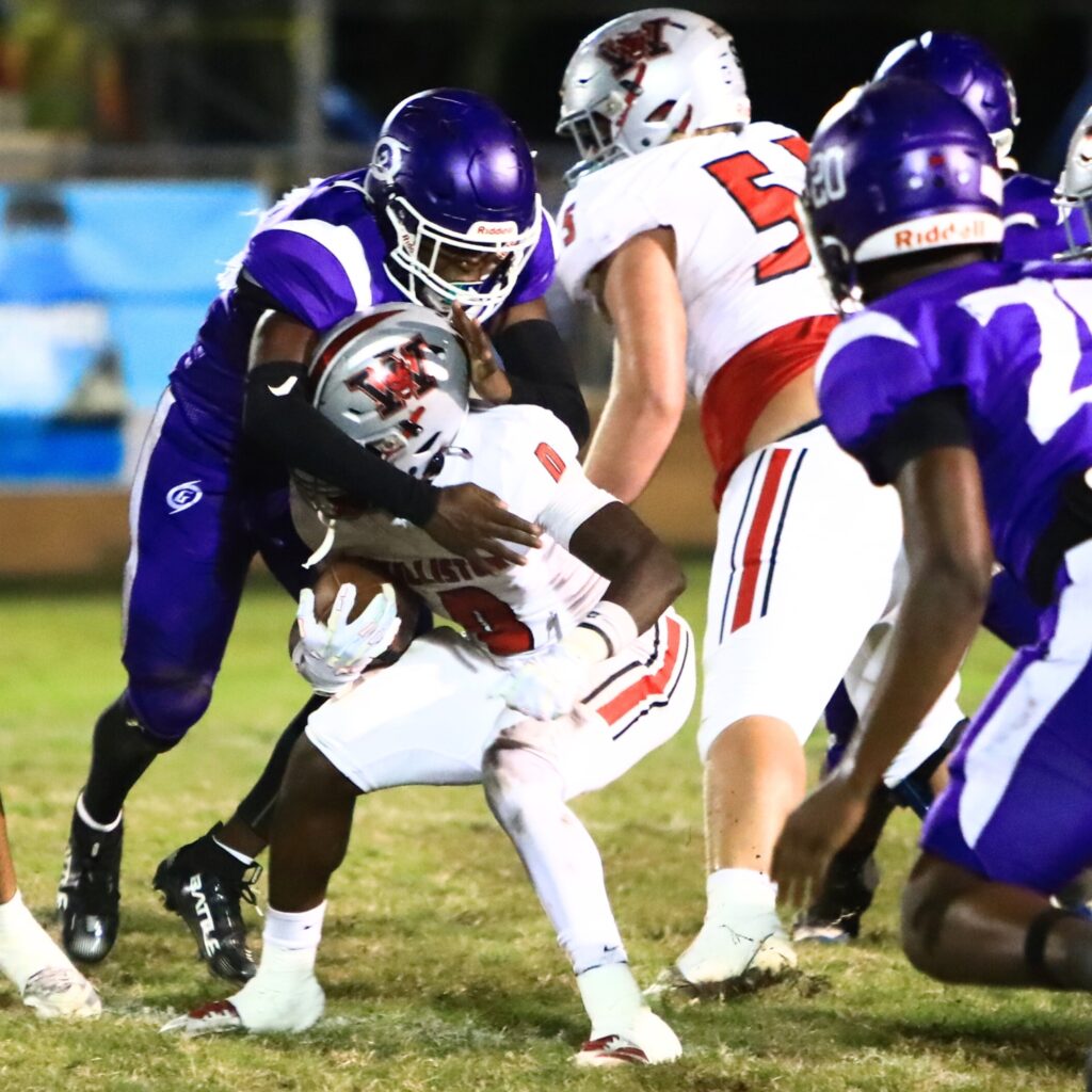 Gainesville's Neriah Washington brings down Williston's Omarian Walker (0). Photo by C.J. Gish
