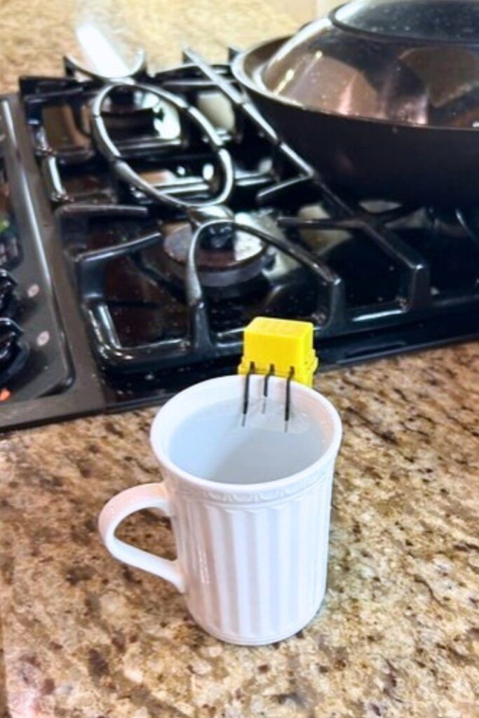 Marie Dolan’s liquid level indicator keeps her from spilling any liquids when she prepares a cup of tea or coffee. Photo by Ronnie Lovler