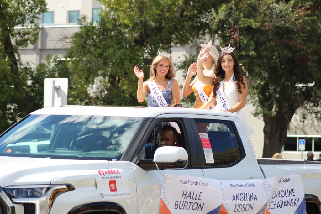 Miss Ocala Caroline Schapansky, Miss Florida Citrus Halle Burton and Miss Heart of Florida Angelina Eidson in the UF Homecoming Parade