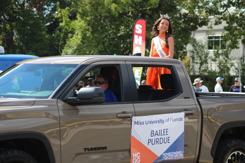 Miss University of Florida Bailee Purdue smiles at spectators