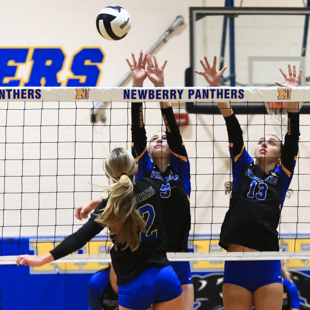 Newberry's Avery Shine (5) and Baylee Akers (13) go for a block against Palatka in the Class 3A-District 5 semifinals. Photo by C.J. Gish