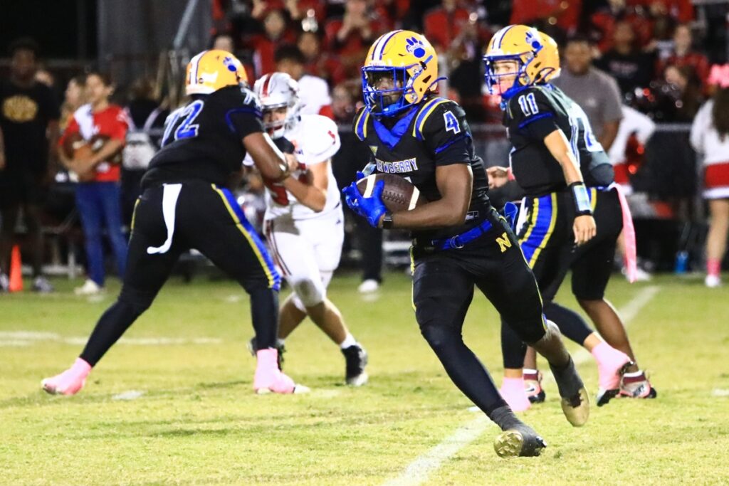 Newberry's Hayden Moore (4) with a third-quarter end around run against Williston. Photo by C.J. Gish