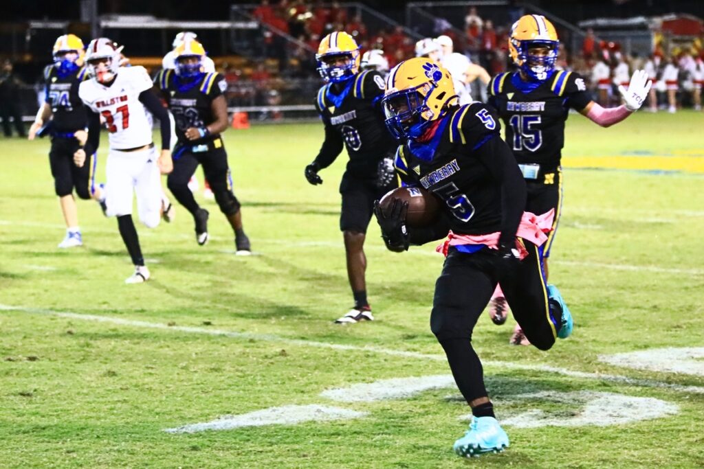 Newberry's Jamarcus Wimberly (5) breaks free for his second first-half touchdown against Williston. Photo by C.J. Gish