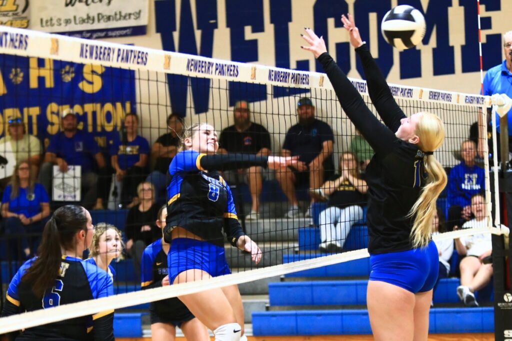 Newberry's Livi Clanton (8) with a hit against Palatka in the Class 3A-District 5 semifinals. Photo by C.J. Gish