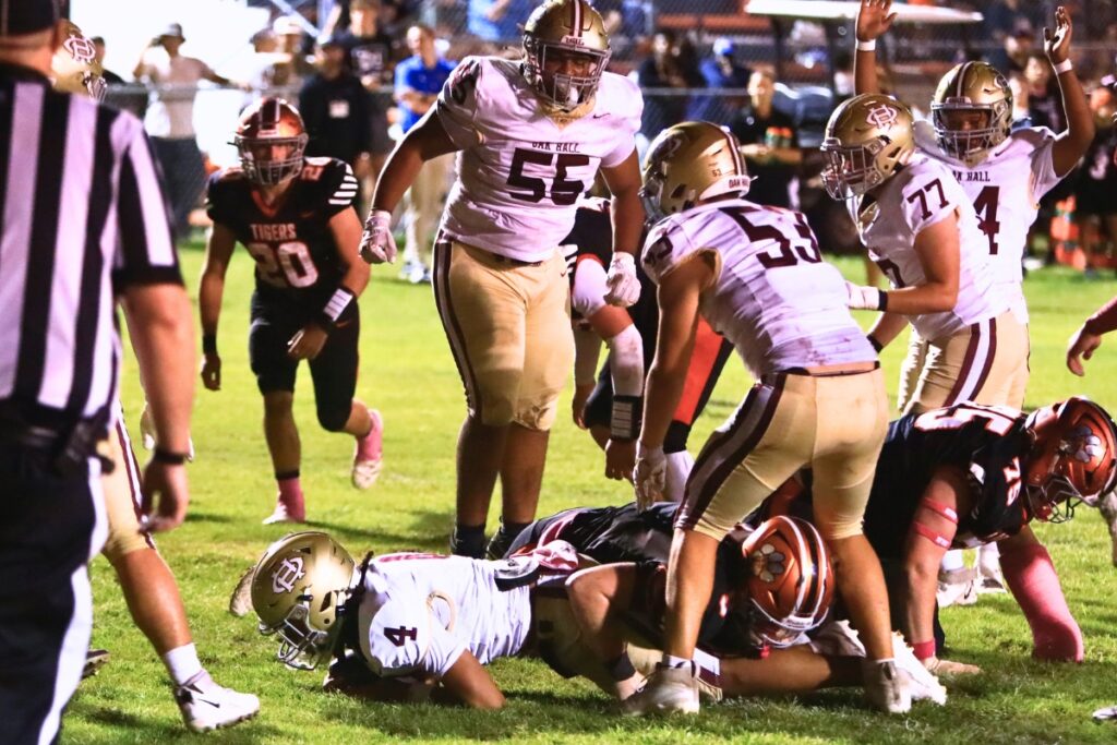 Oak Hall's Aaron Akins (4) scores on a second-quarter quarterback sneak against Trenton. Photo by C.J. Gish