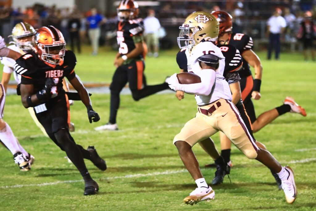Oak Hall's Amari Ray (16) with a second-quarter kickoff return against Trenton. Photo by C.J. Gish
