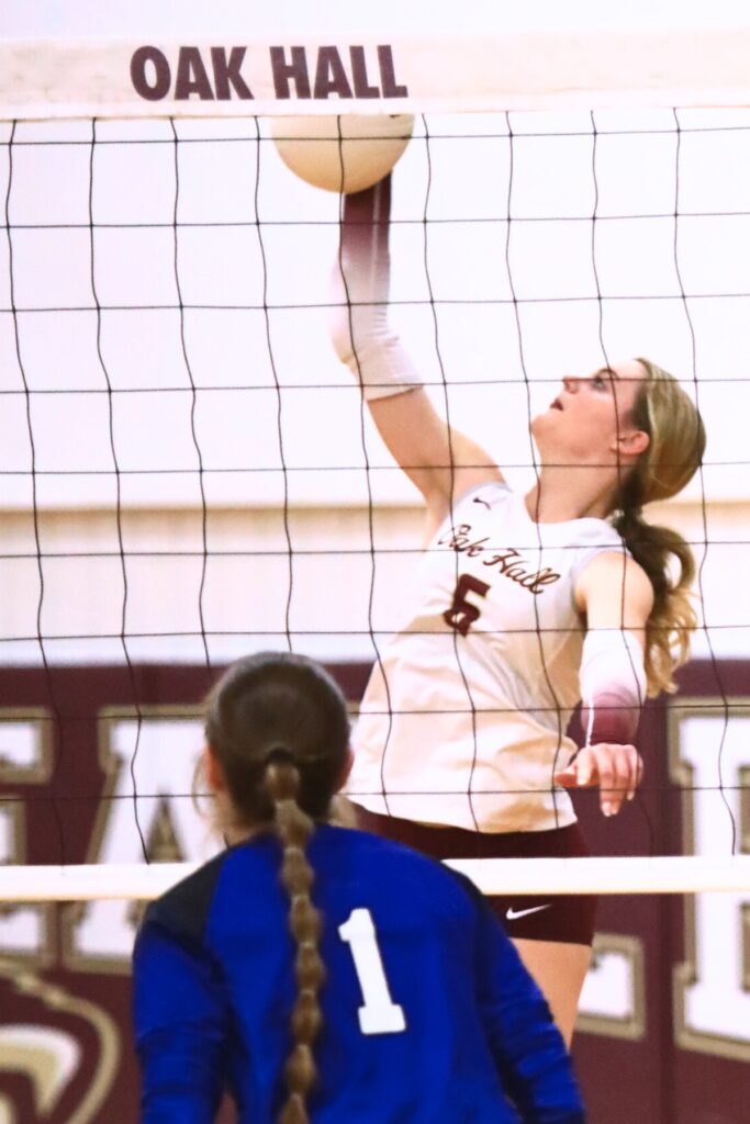 Oak Hall's Hannah Timm (6) with a hit against Saint Francis Catholic. Photo by C.J. Gish
