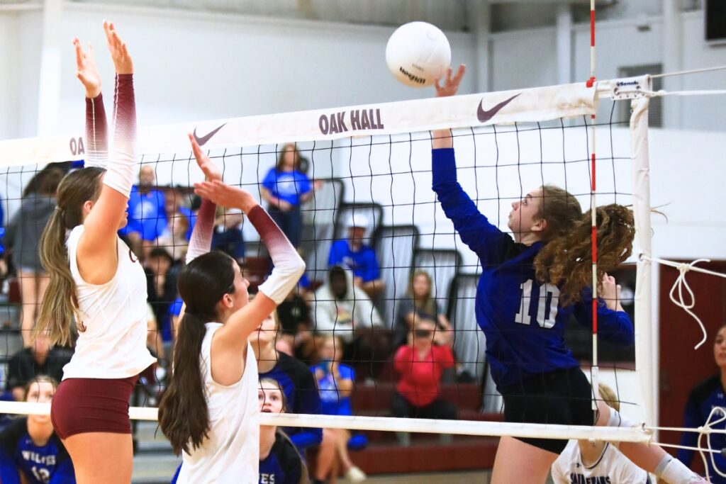 Saint Francis Catholic's Hannah Ulmer (10) with a hit against Oak Hall. Photo by C.J. Gish
