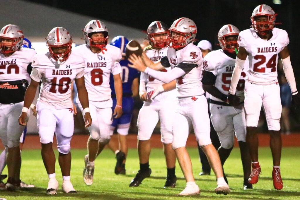 Santa Fe's Trent McFarland (14) with a second-quarter fumble recovery against Keystone Heights. Photo by C.J. Gish