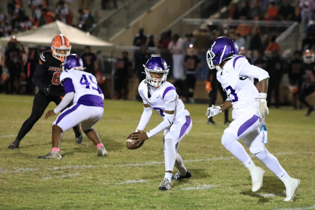 The Hurricanes pitch the ball to Sy'ron Jones. 