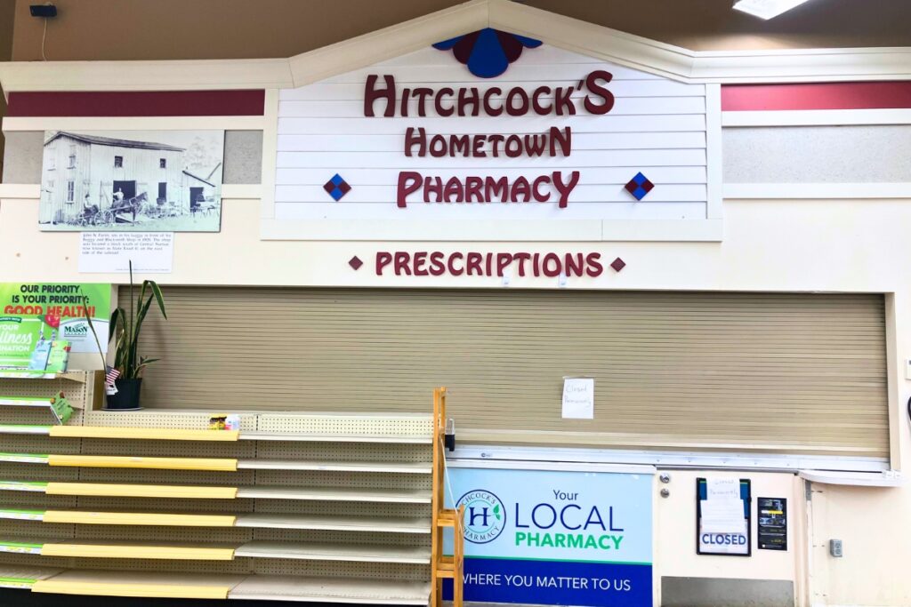 The pharmacy window is closed and medicinal shelves empty at Hitchcock's in Newberry as the store transitions into Bravo. Photo by Lillian Hamman