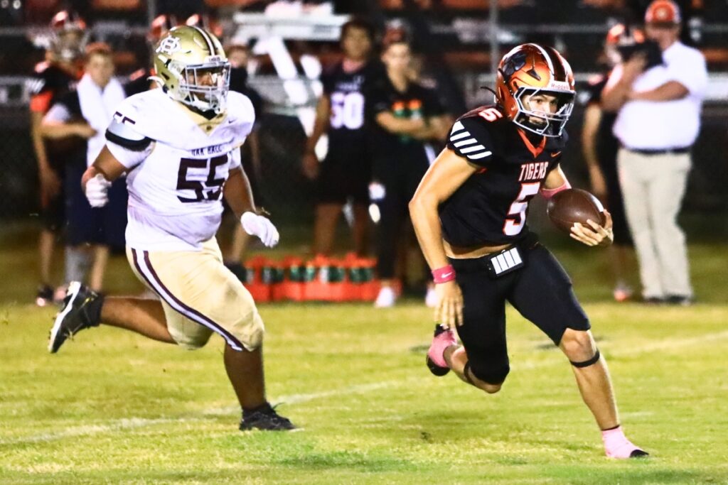 Trenton quarterback Jackson Gentry (5) with a second-quarter run against Oak Hall. Photo by C.J. Gish