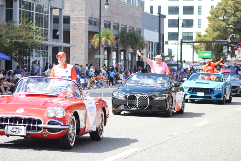 UF interim President Donald Landry leads the pack of university, state and city leaders Friday afternoon.
