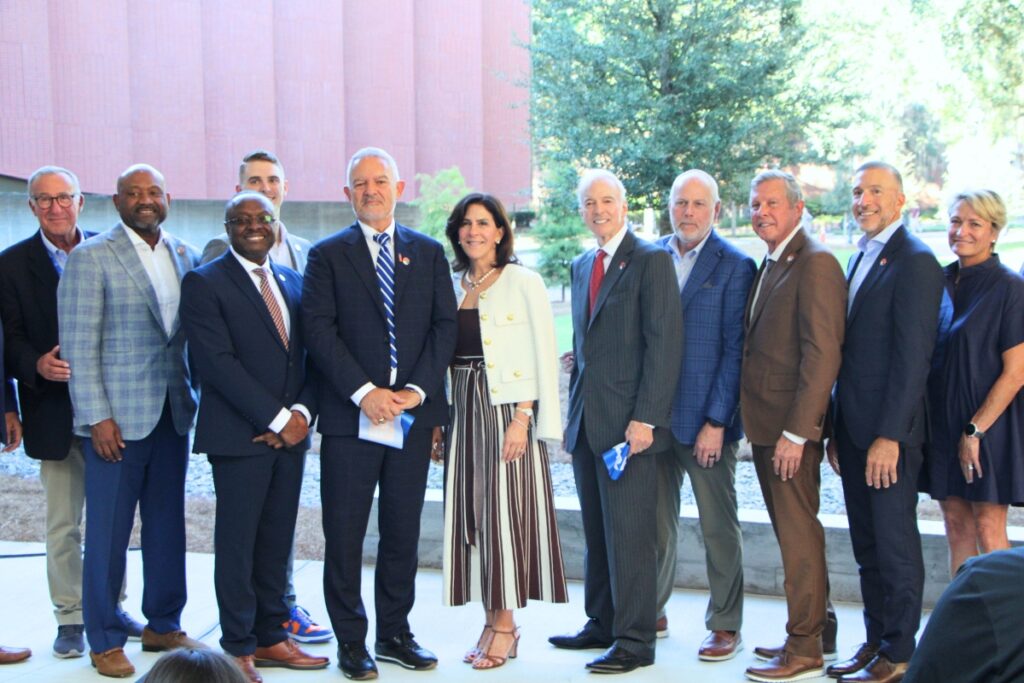 UF officials and project leaders celebrate the opening of the Bruno E. and Maritza F. Ramos Collaboratory with a ribbon cutting. Photo by Lillian Hamman