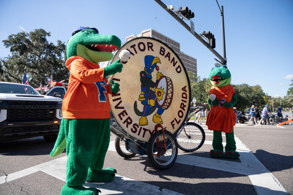 UF's Albert and Alberta swinging to hit Big Boom at the UF Homecoming Parade.
