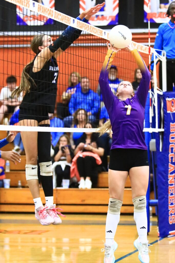 Union County's Abby Williams (7) puts the ball up against Branford's Lalyn Sikes (7). Photo by C.J. Gish
