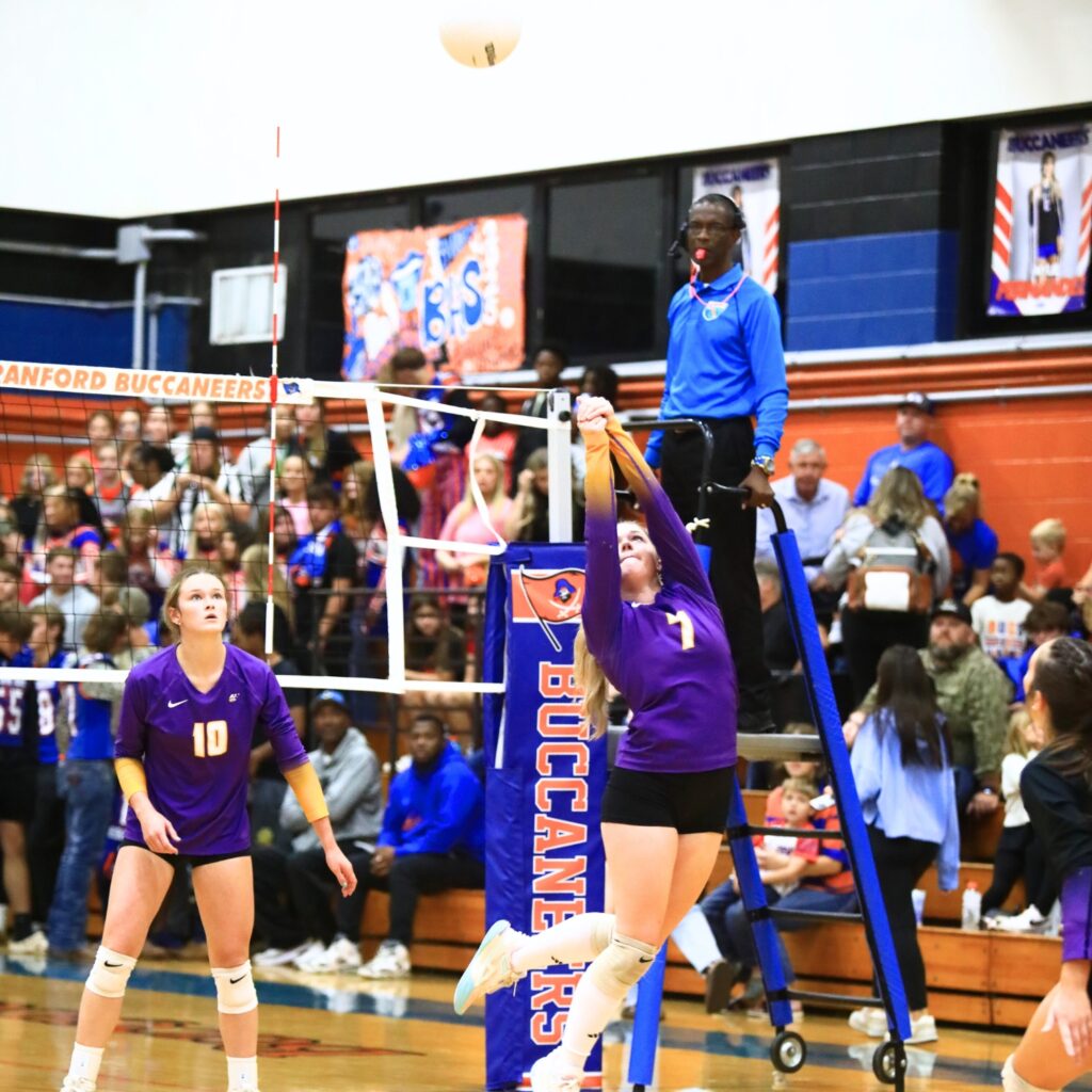 Union County's Abby Williams (7) with a dig against Branford. Photo by C.J. Gish