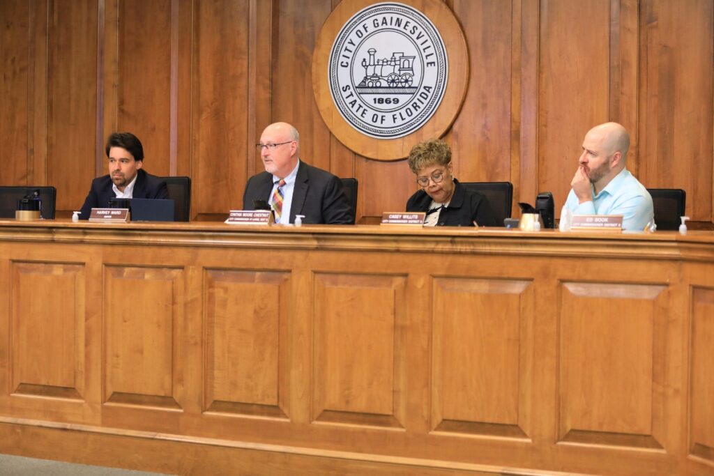 From left, Commissioner Bryan Eastman, Mayor Harvey Ward, Commissioner Cynthia Chestnut and Commissioner Casey Willits consider a sale of land at a General Policy Committee meeting.