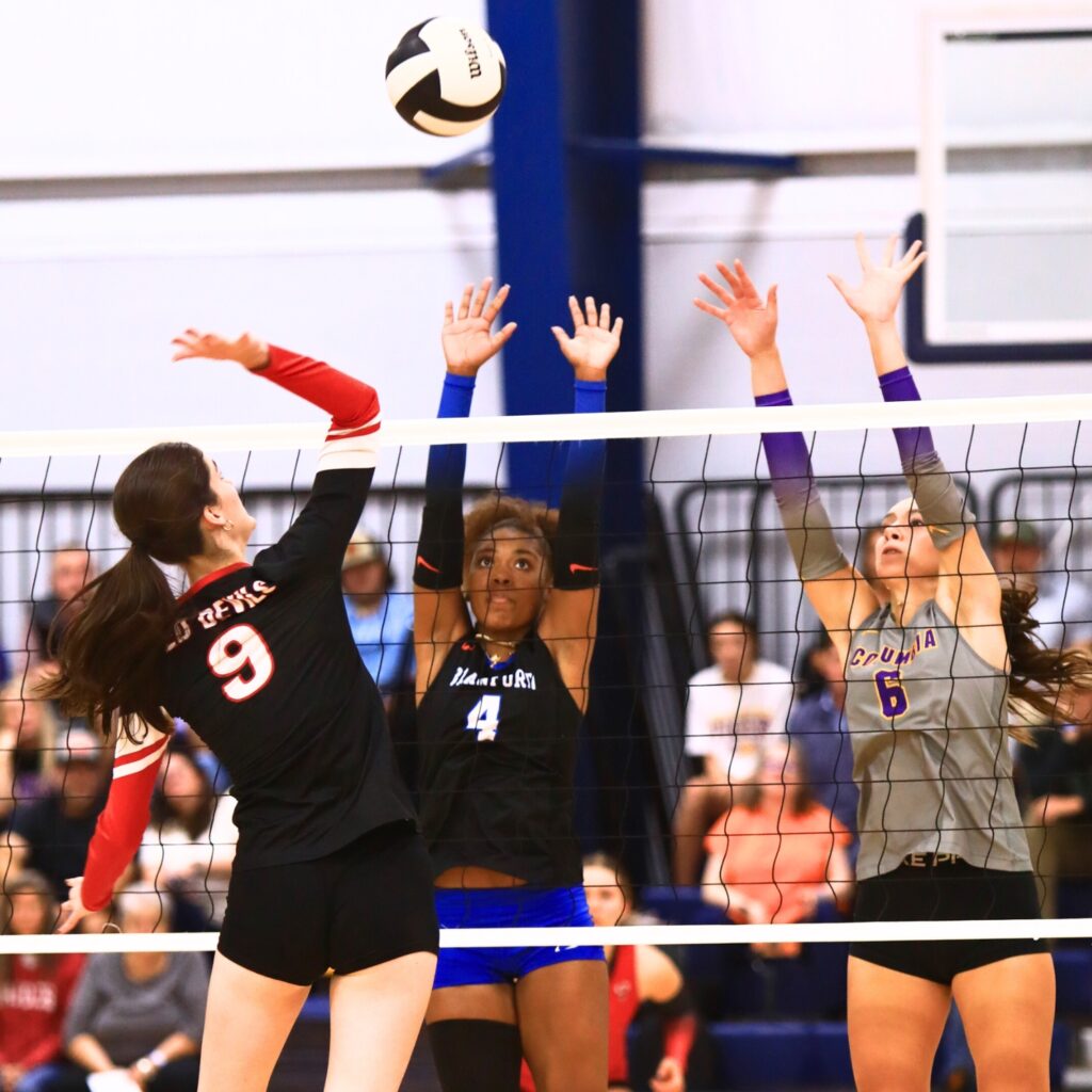 Branford's Adriauna Combs (4) and Columbia's Senei Wood (6) go for a block against Williston's Kai Gowland at The Prep Zone All-Star Showcase. Photo by C.J. Gish