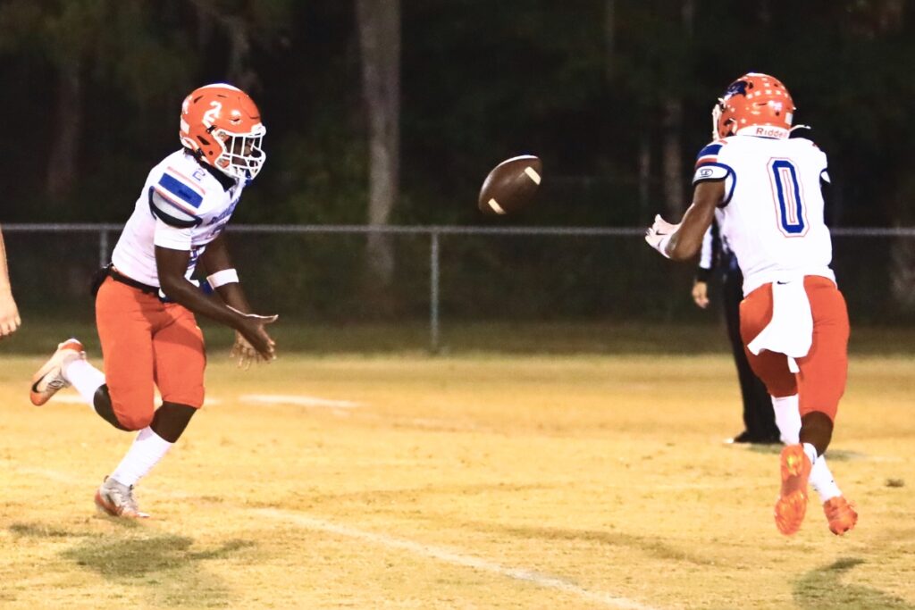 Branford's Ollie James (2) pitches the ball to Maurice Vought (0) on a first-quarter reverse against Hawthorne in the Rural Regional Semifinals. Photo by C.J. Gish