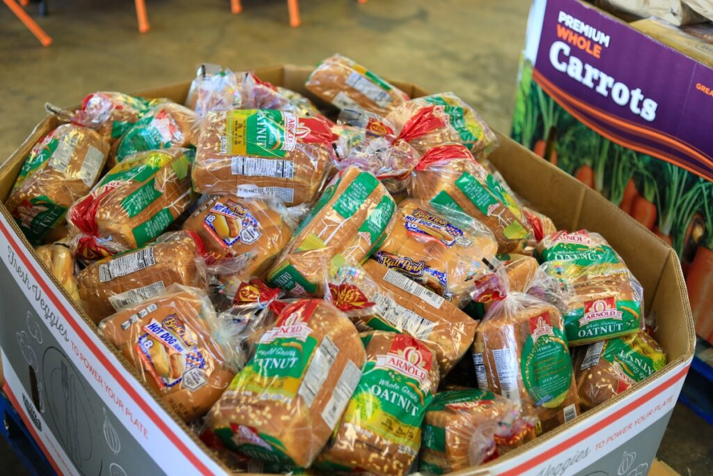 Bread donated by local grocery stores is sorted at Bread of the Mighty in Gainesville. Photo by Seth Johnson