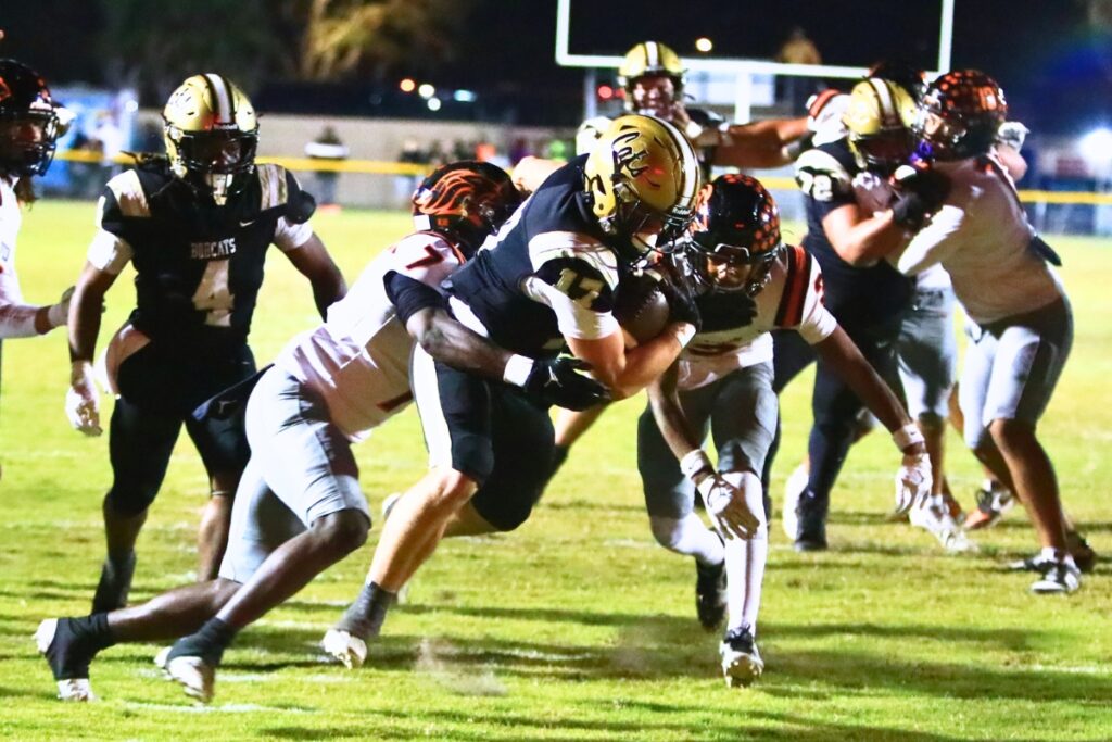 Buchholz's Ashton Norris (17) scores on the Bobcats' opening drive against Oviedo in the Region 1-6A Quarterfinals. Photo by C.J. Gish