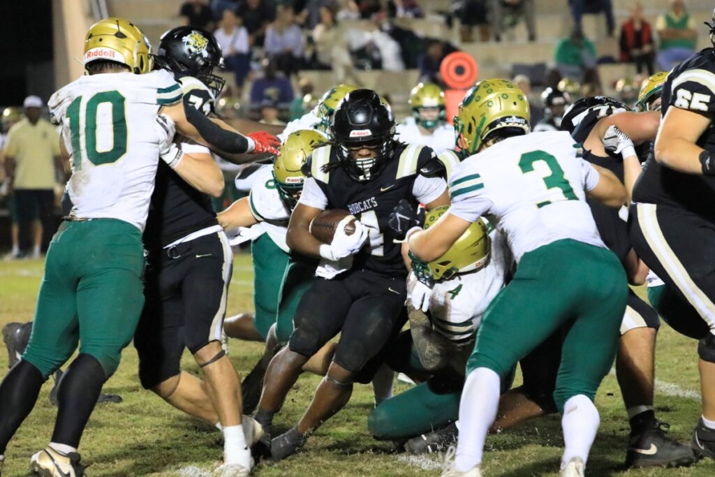 Buchholz's Josh Menefee (4) pushes for extra yardage on a run against Nease (Ponte Vedra) in the Class 6A-Region 1 Semifinals. Photo by Seth Johnson