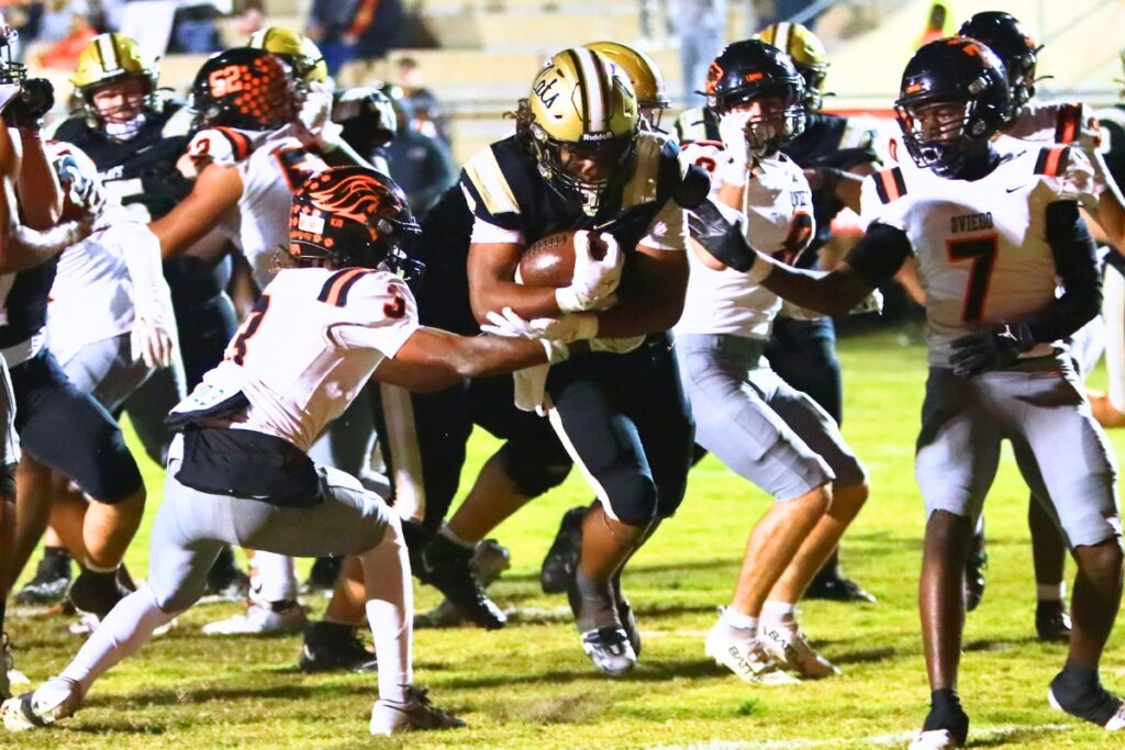 Buchholz's Josh Menefee (4) scores in the first quarter for a 14-0 lead against Oviedo in the Region 1-6A Quarterfinals. Photo by C.J. Gish