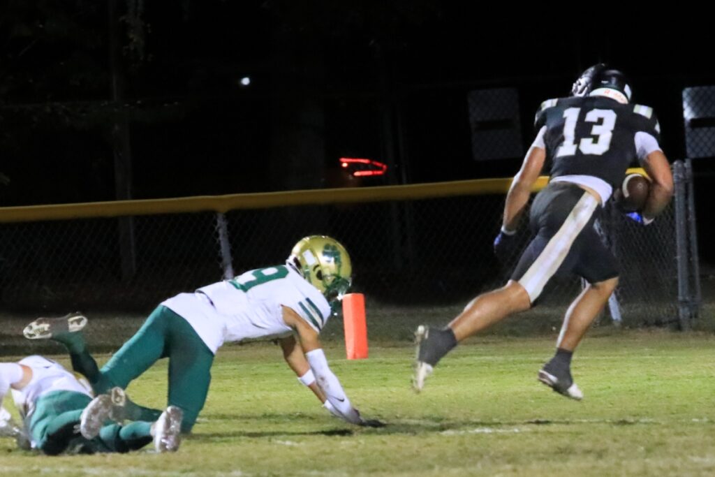 Buchholz's Justin Williams (13) ditches a Nease (Ponte Vedra) defenders for the Bobcats' second touchdown in the Class 6A-Region 1 Semifinals. Photo by Seth Johnson