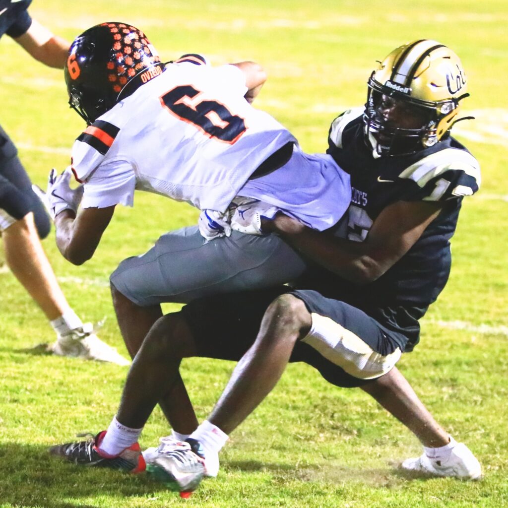Buchholz's Marquel Brook (12) with a second-quarter tackle against Oviedo in the Region 1-6A Quarterfinals. Photo by C.J. Gish