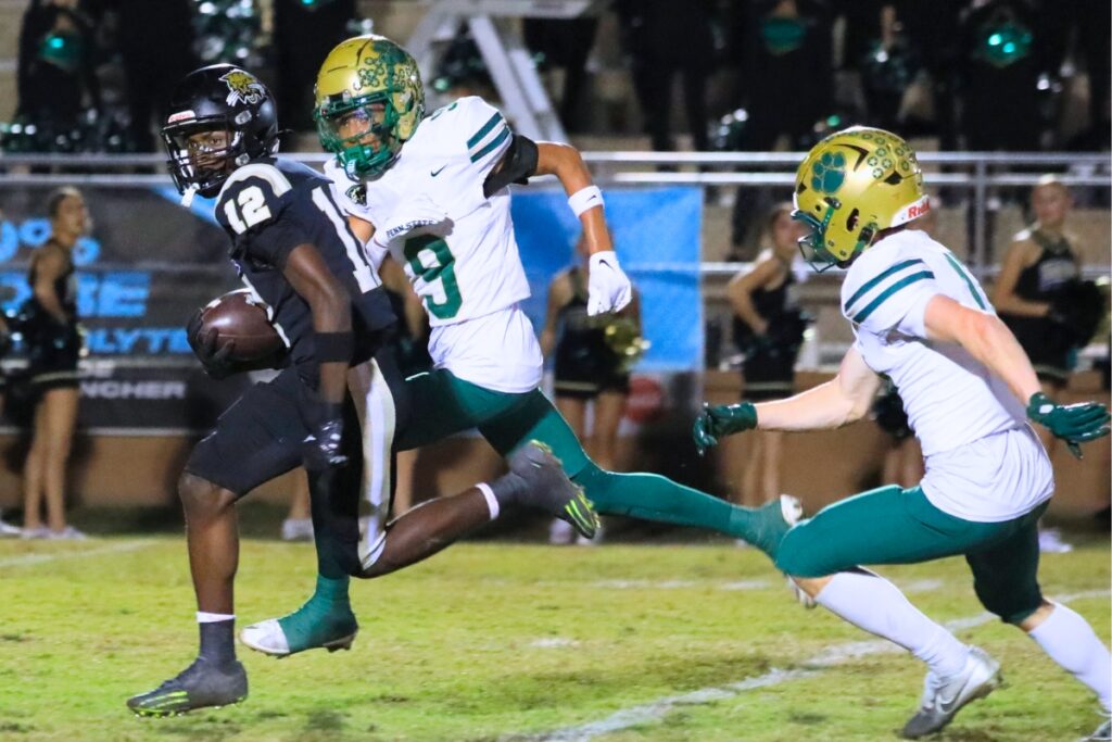 Buchholz's Marquel Brooks (12) catches a short pass and runs more than 20 yards for the first touchdown of the game against Nease (Ponte Vedra) in the Class 6A-Region 1 Semifinals. Photo by Seth Johnson