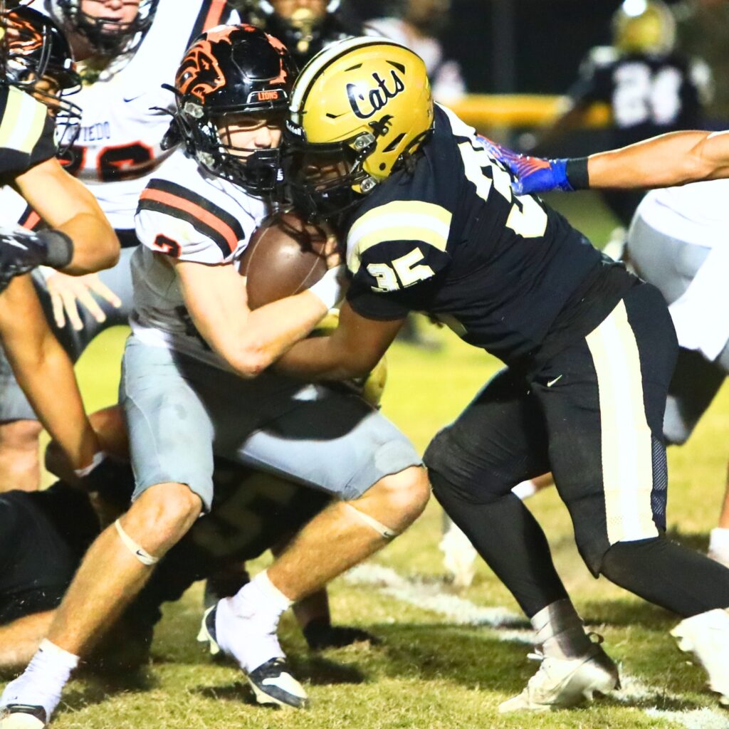 Buchholz's Zay Robinson (35) with a second-quarter tackle against Oviedo in the Region 1-6A Quarterfinals. Photo by C.J. Gish