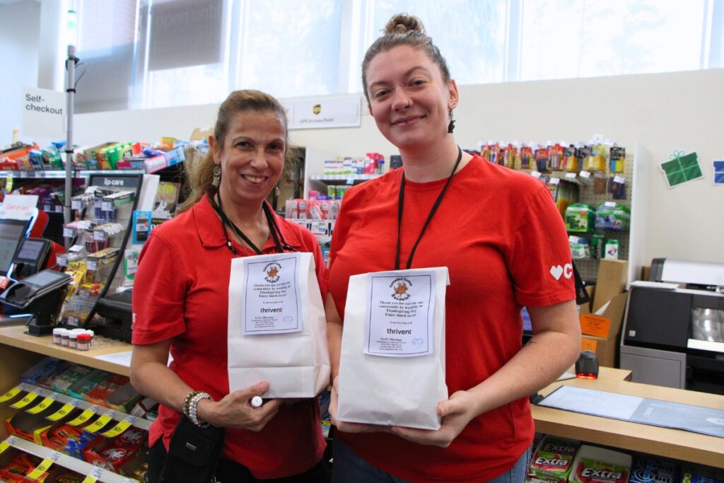 CVS employees take a break on Thanksgiving to enjoy a free lunch from Operation Turkey Sandwich. Photo by Lillian Hamman