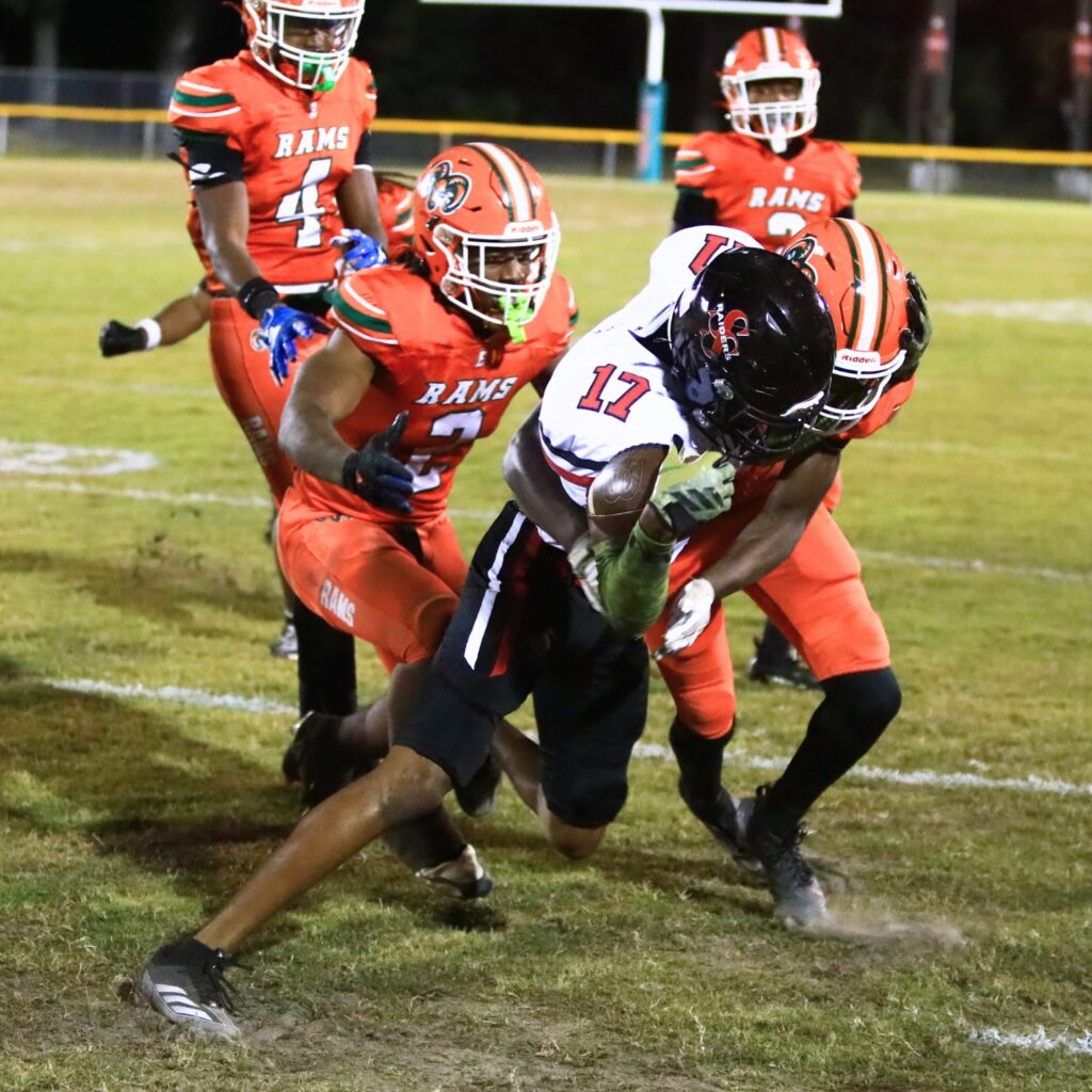 Eastside's Ja'Marian Reaves (22) and Demarco Daniels (2) with a tackle against South Sumter in the Region 2-3A Quarterfinals. Photo by C.J. Gish