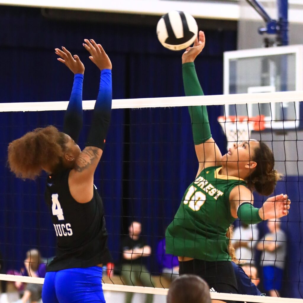 Forest's Ava Robinson (10) with a hit against Branford's Adriauna Combs (4) at The Prep Zone All-Star Showcase. Photo by C.J. Gish