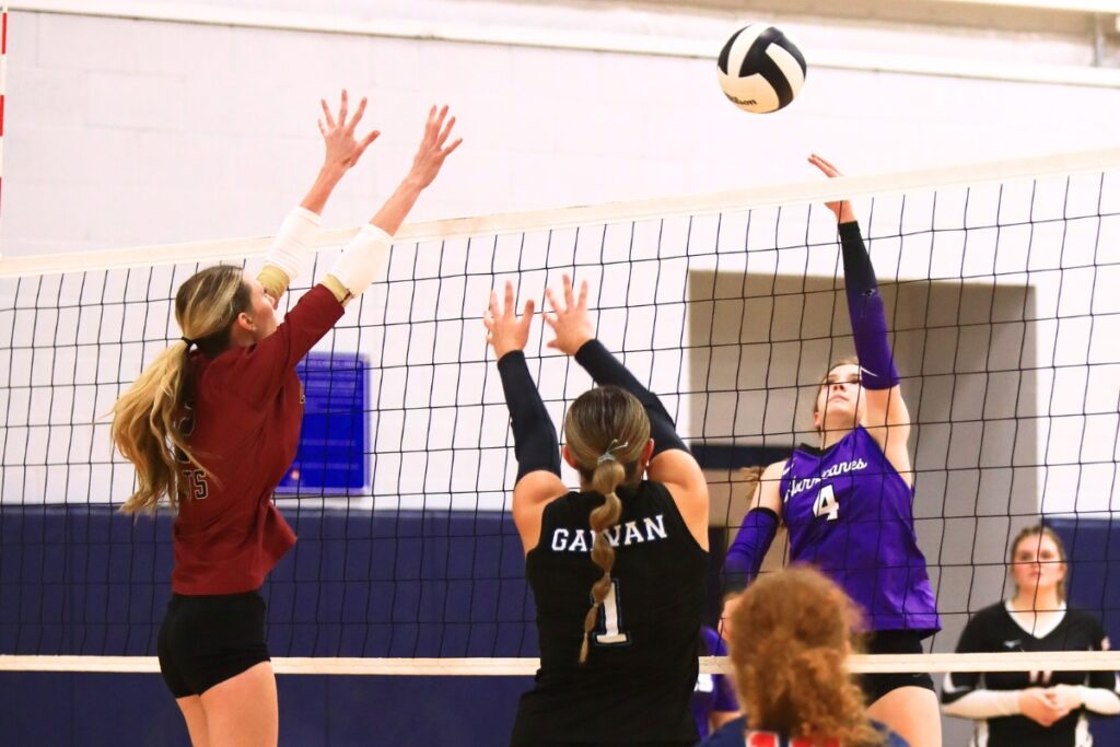 Gainesville's Rowan Kage (4) with a hit against North Marion's Jacelyn Carson (2) and West Port's Joslynn Galvan (1) at The Prep Zone All-Star Showcase. Photo by C.J. Gish