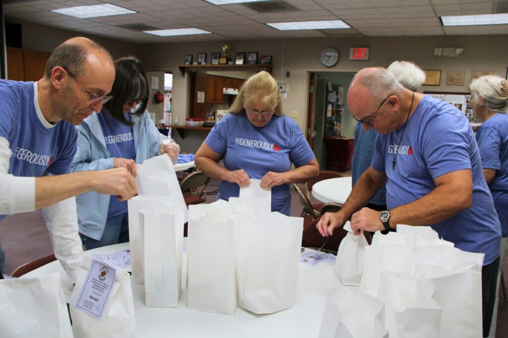 Gethsemane Lutheran Church members and community volunteers package 160 lunches for 'Operation Turkey Sandwich.' Photo by Lillian Hamman