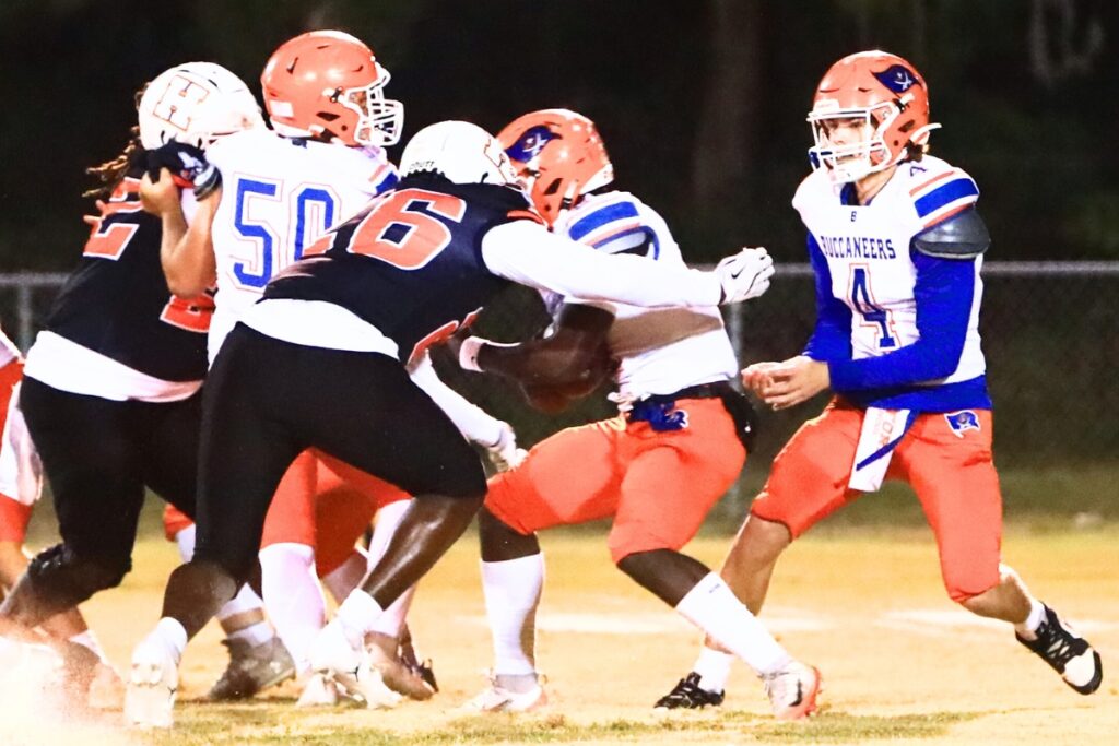 Hawthorne's Dracen Martin (26) tackles Branford's Ollie James (2) for a loss in the Rural Regional Semifinals. Photo by C.J. Gish