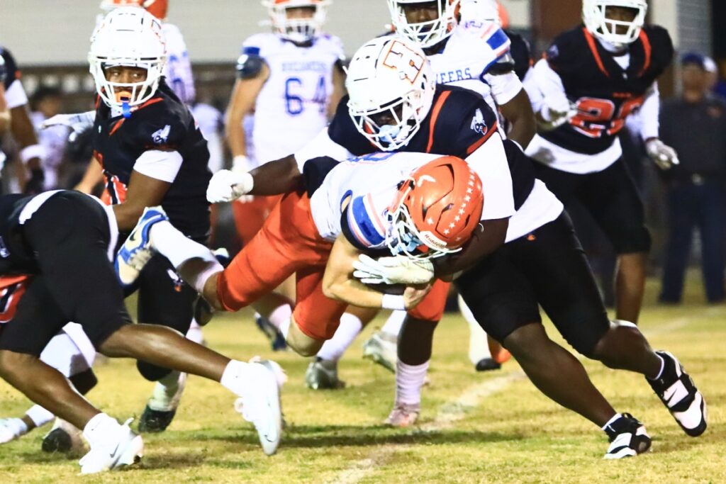 Hawthorne's Kyler Ingram (10) brings down Branford's Tripp Schultz (8) in the Rural Regional Semifinals. Photo by C.J. Gish