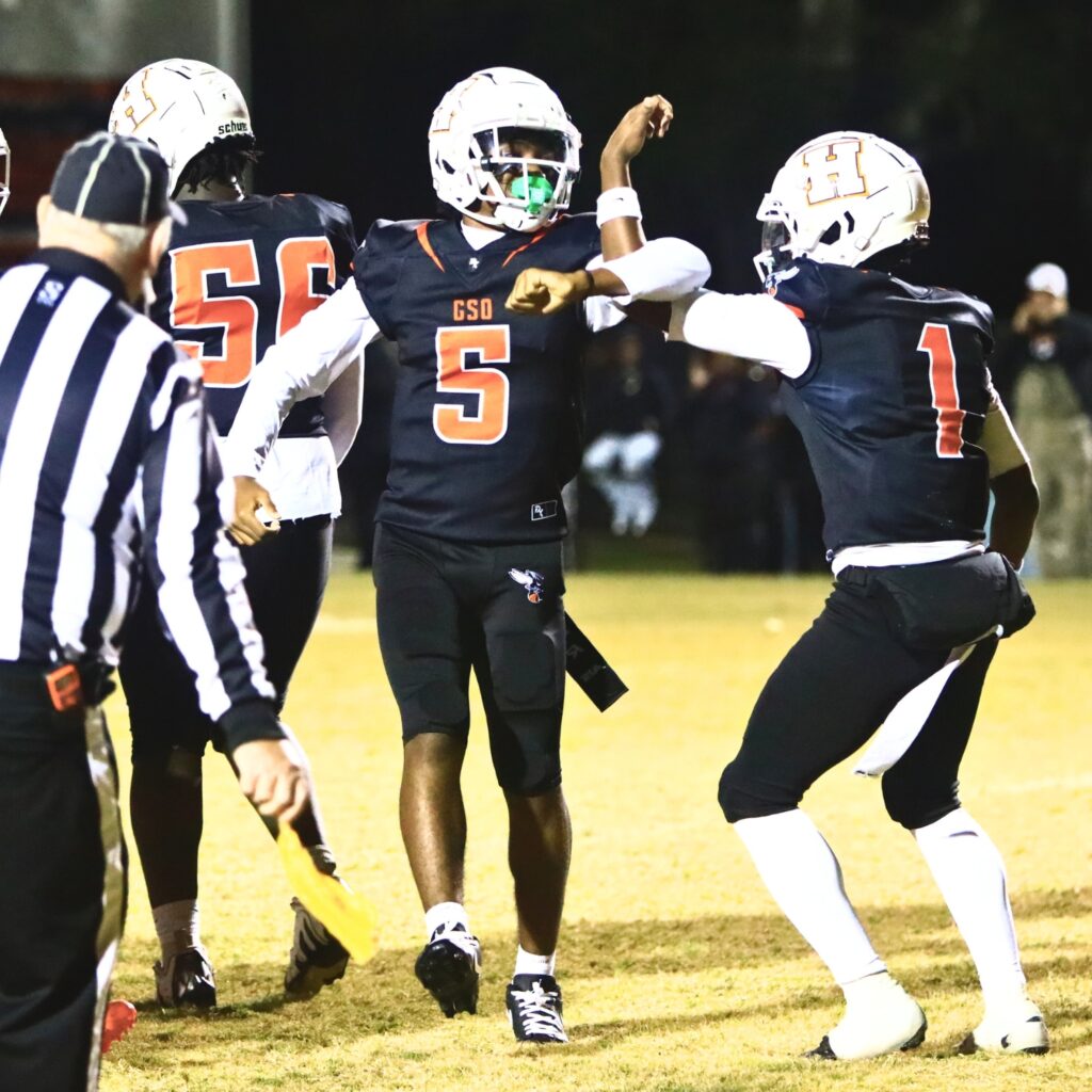 Hawthorne's Richard Roundtree Jr. (5) and Darian Bowie (1) celebrate after Roundtree's second-quarter touchdown against Branford. Photo by C.J. Gish