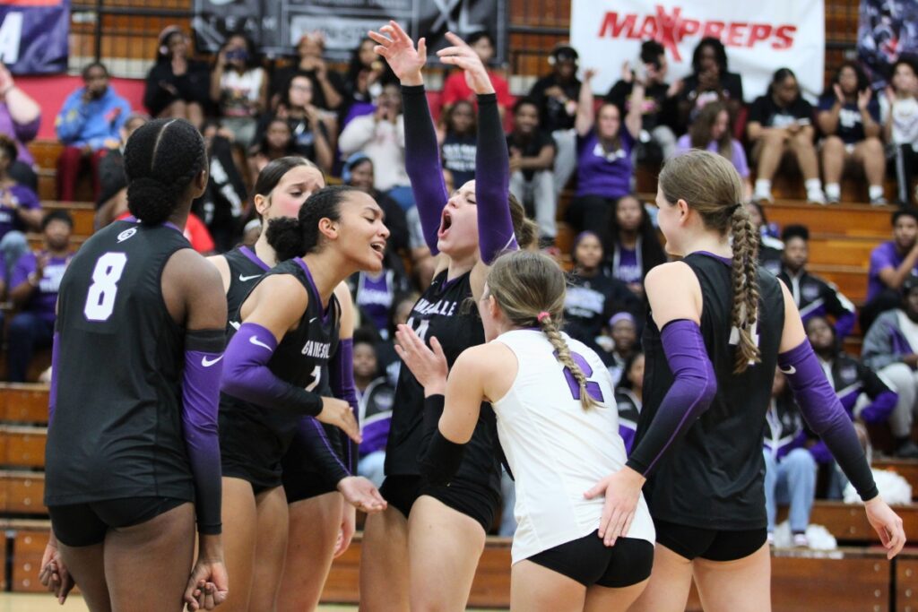 Hurricanes celebrate Jordyn Barnards early block against Archbishop McCarthy (Fort Lauderdale) in the Class 5A state semifinals. Photo by Vinnie Cammarano