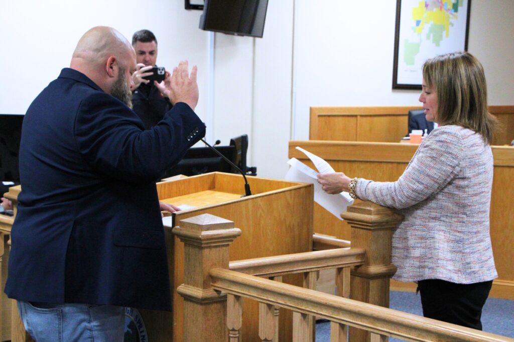 Incumbent Tristan Grunder (left) is sworn in to the High Springs Commission Seat 3 by City Clerk Angela Stone on Thursday. Photo by Lillian Hamman