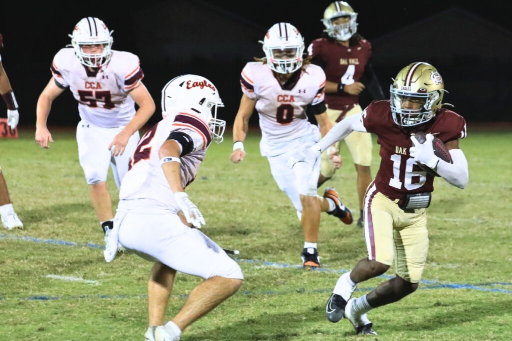 Oak Hall's Amari Ray with a run against Christ's Church Academy (Jacksonville). Photo by Seth Johnson
