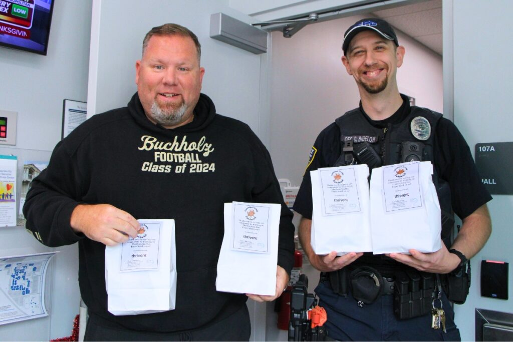 Santa Fe College police officers receive lunches from Operation Turkey Sandwich. Photo by Lillian Hamman