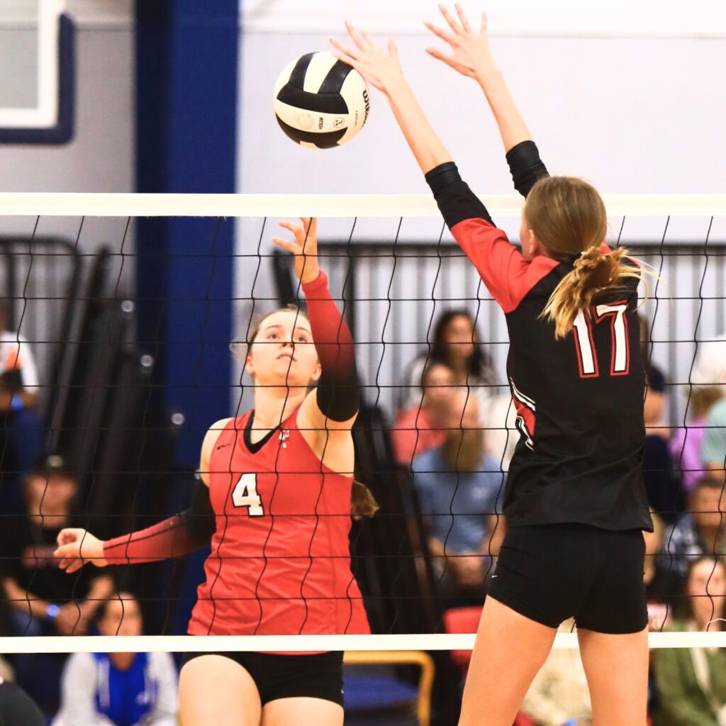 Santa Fe's Brooke Findley (4) with a hit against The Rock's Brianna Stevens at The Prep Zone All-Star Showcase. Photo by C.J. Gish