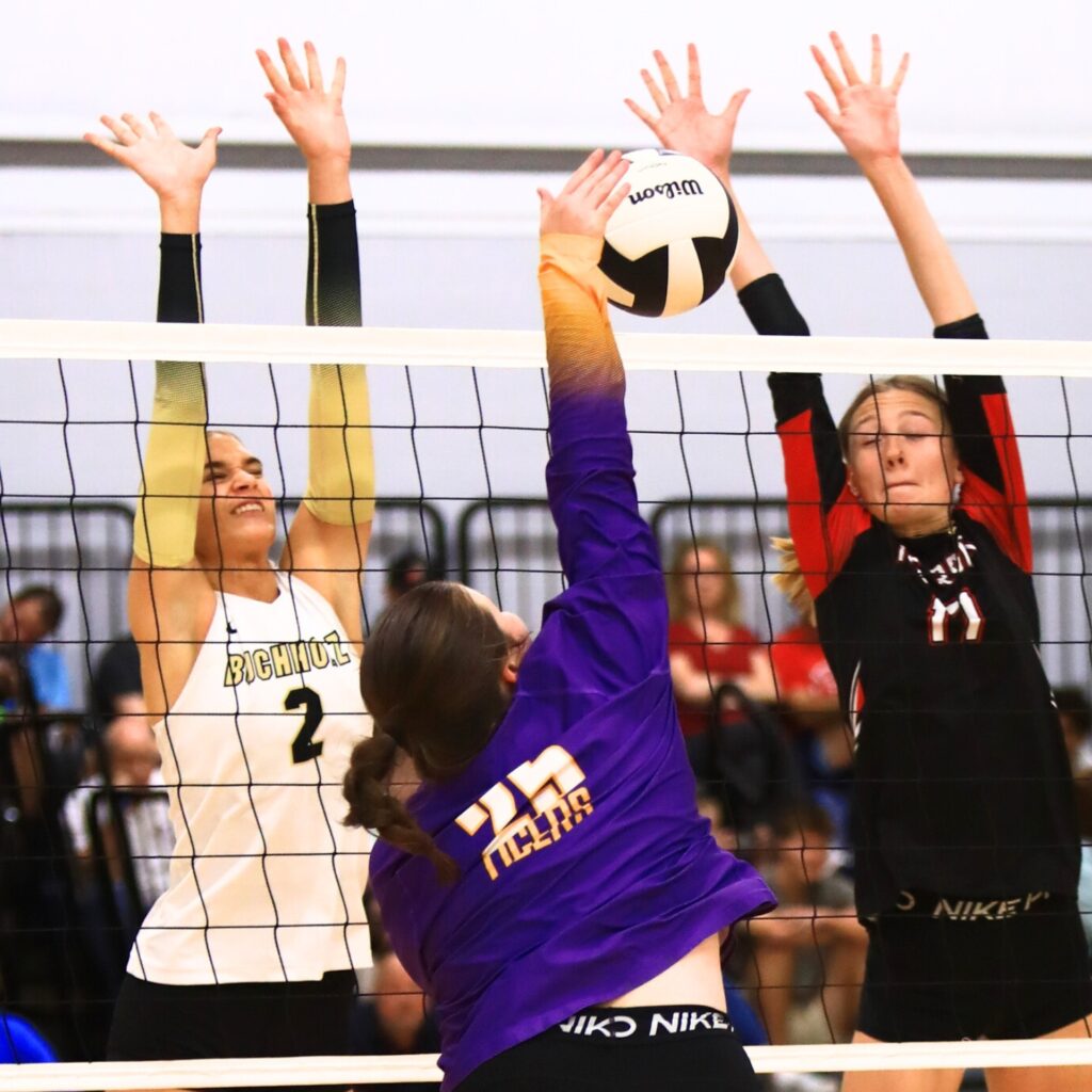 Union County's Indi Knox (25) with a hit against Buchholz's Addie Sixbey (2) and The Rock's Brianna Stevens (17) at The Prep Zone All-Star Showcase. Photo by C.J. Gish
