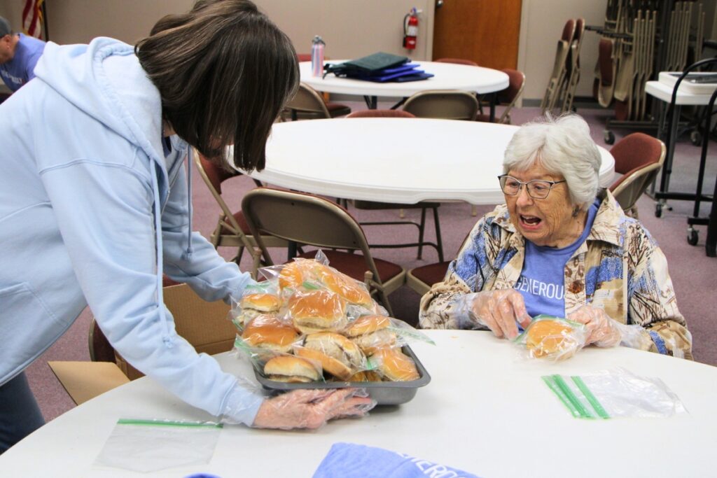 Volunteers work together on Thanksgiving to package meals for Operation Turkey Sandwich. Photo by Lillian Hamman (1)